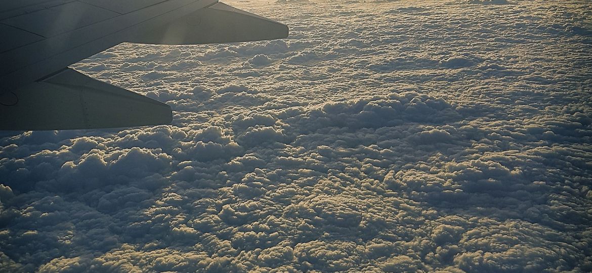 Airplane flying over the clouds